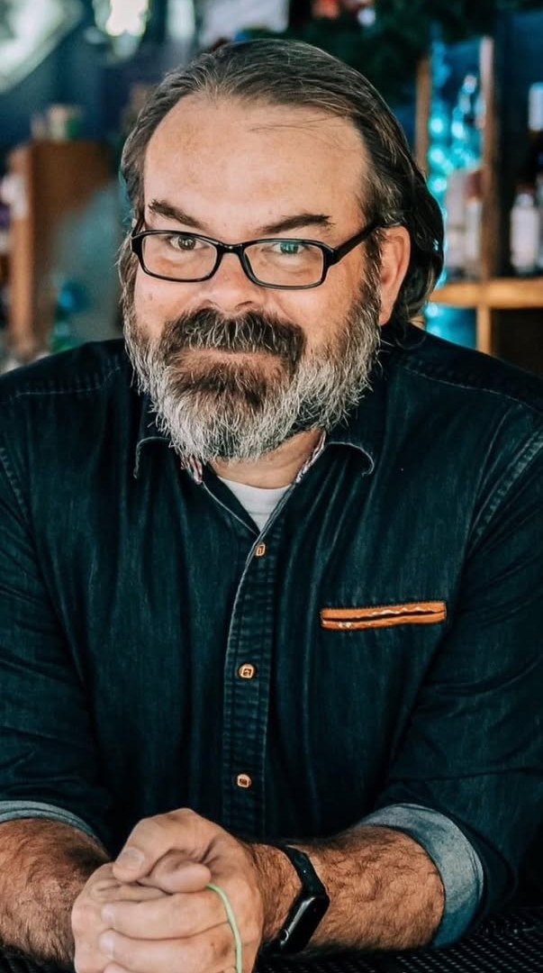 Ben Mouton, restaurant operations leader, at the bar of his restaurant